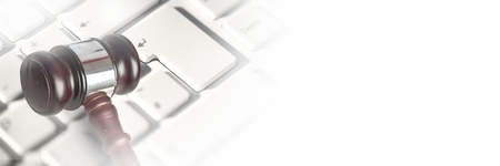 Digital composite of Gavel and keyboard with transitionの写真素材