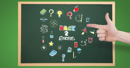 Digital composite of Hand pointing at Back to school Education drawing on blackboardの写真素材