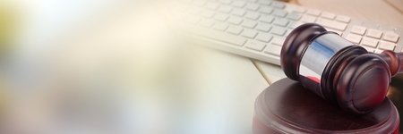 Digital composite of Gavel and keyboard with apple with transitionの写真素材