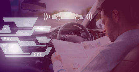 Digital composite of Man driving in car with heads up display interface