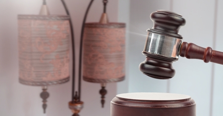 Digital composite of Gavel and antique lamps auction