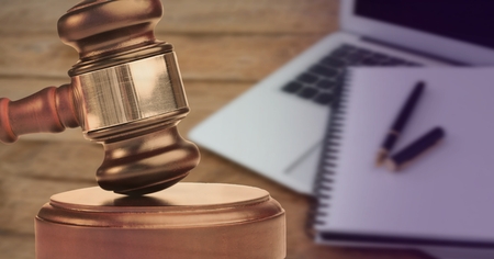 Digital composite of Gavel and keyboardの写真素材