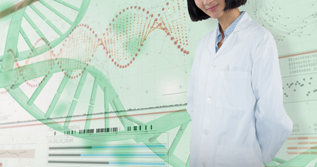 Smiling doctor standing against white background against helix diagram of dna