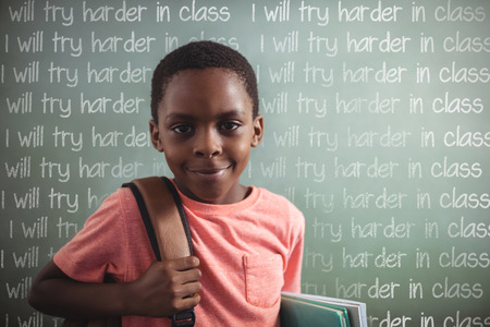 Punishment lines against portrait of boy with backpack and books against greenboard
