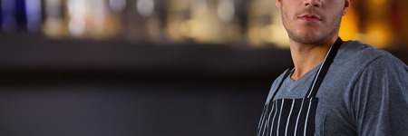 Composite image of male waiter standingの写真素材