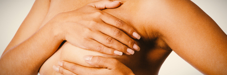 Shirtless woman for breast cancer awareness on white backgroundの写真素材