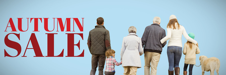 Happy family walking with their dog against blue backgroundの写真素材