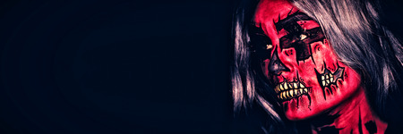 Young woman with makeup on her head to scareの写真素材