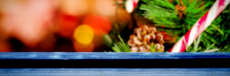 Snow falling against bauble decorations on christmas treeの写真素材