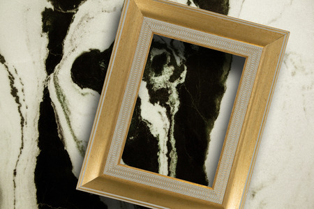 Empty photo frame against modern marble surface