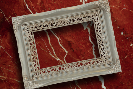 Empty photo frame against modern marble surface