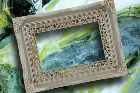 Empty photo frame against modern marble surface