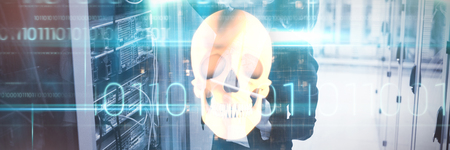 Orange human skull against blue technology design with binary codeの写真素材