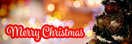 White and red greeting against christmas yellow circle lightsの写真素材