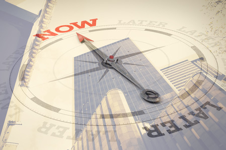 Compass with text against low angle view of office buildingの写真素材