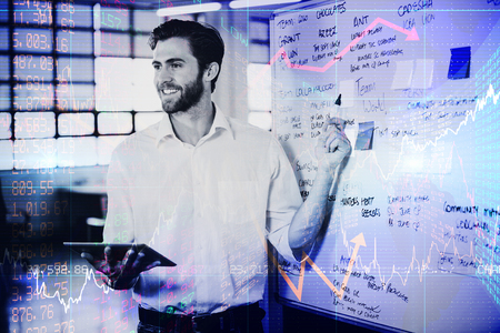 Stocks and shares against smiling businessman explainging strategies on whiteboardの写真素材