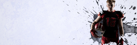 Volleyball player holding rugby helmet against grey vignetteの写真素材