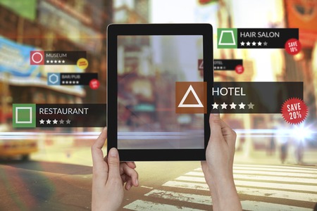 Tablet with Applications  against blurred new york street