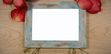 Empty photo frame and rose flowerの写真素材