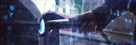 Virus background against man charging electric car at charging stationの写真素材