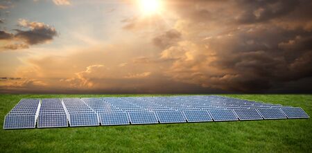 Solar panels  against grassの写真素材