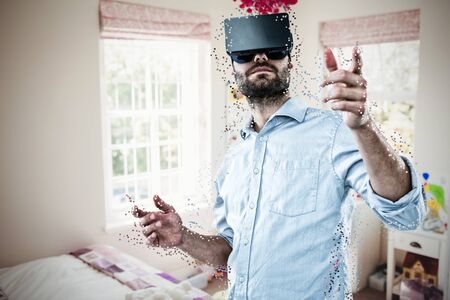 Low angle view of man using vr headset against bedroom