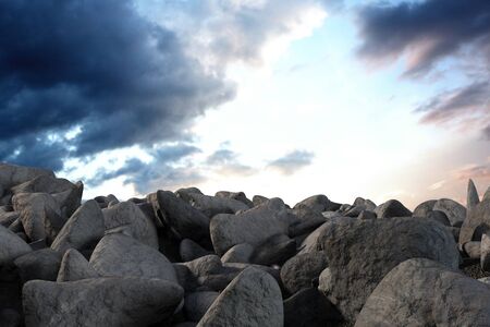 pile of rocks against full frame shot of skyの写真素材