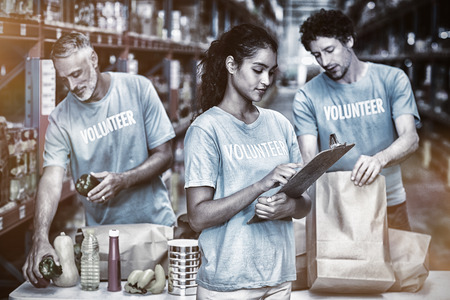 Attentive volunteers working in a warehouse