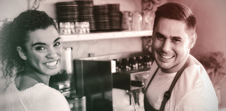 Portrait of smiling waitress and waiter in cafeの写真素材