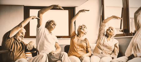 Seniors doing exercises in a retirement homeの写真素材