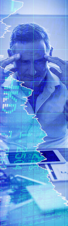 Stocks and shares against businessman frustrated at his desk