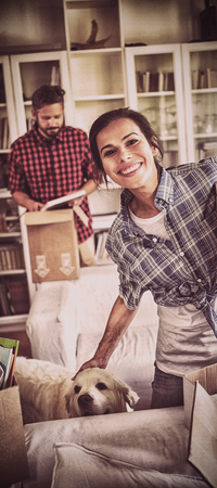 Happy couple unpacking cartons in their new houseの写真素材