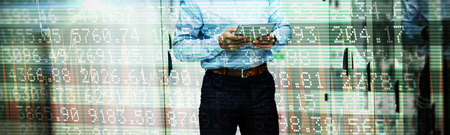Stocks and shares against technician using digital tablet