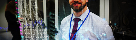 Stocks and shares against smiling technician standing in a server room