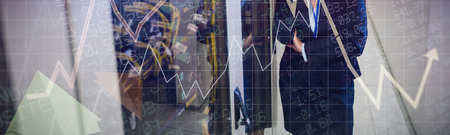 Stocks and shares against female technician talking on mobile phone
