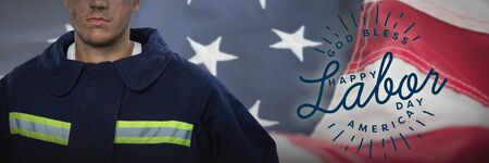 Serious Fireman against full frame of american flag. USA Labor Day Concept Advertisement. USA Labor Day Concept Advertisementの写真素材