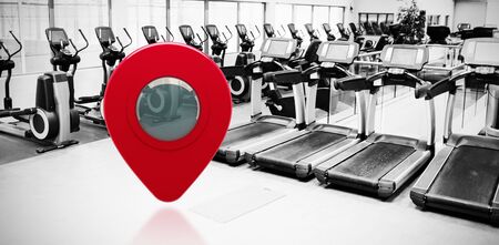 Close-up of map marker against collection of treadmills and exercise bikes