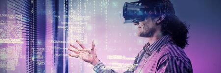Image of data against male executive using virtual reality headset in waiting area