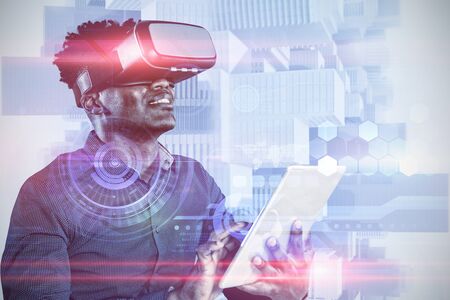 Male African-american use virtual reality headset and digital tablet against view from balcony over...