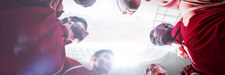 Sport men looking each other  against football stadiumの写真素材