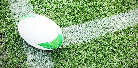 Close-up of Rugby ball on a grass in the stadiumの写真素材