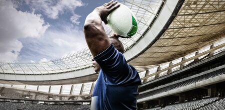 Strong Rugby Player against rugby stadium in the morningの写真素材