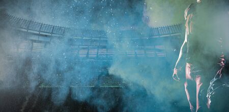 American Football Player against splashing of yellow color powder