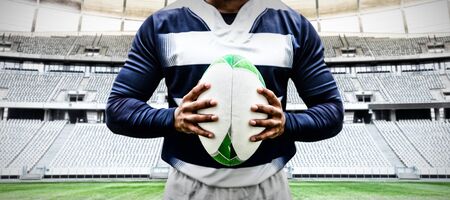 Strong Rugby Player against rugby goal post in a stadium Front view of rugby goal post in a empty stadiumの写真素材