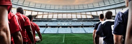Rugby Players Playing Match against rugby stadium at dawnの写真素材