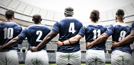 Rugby Team against rugby goal post on a sunny day in the stadiumの写真素材