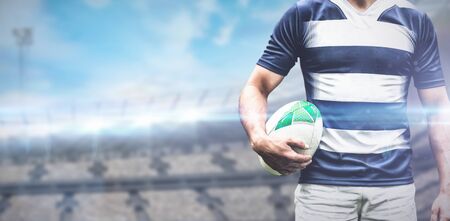 Strong Rugby Player against rugby stadiumの写真素材