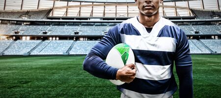 Strong Rugby Player against rugby stadium at dawnの写真素材