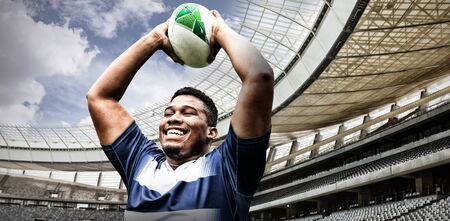 Strong Rugby Player against rugby stadium in the morningの写真素材