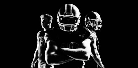 Young American football player standing in helmetの写真素材